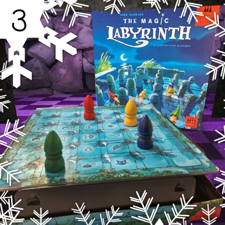 Colorful game pieces on a blue game board for "The Magic Labyrinth," a family board game by Dirk Baumann, featuring a whimsical design and hidden pathways. The game box is visible in the background, showcasing its enchanting artwork.