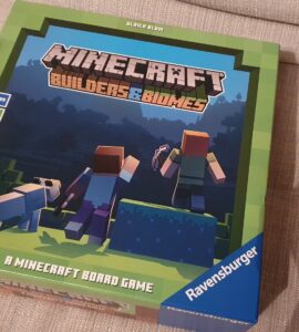 Minecraft Builders & Biomes board game box featuring characters and a dog, designed for 2-4 players aged 10 and up, with a playtime of 30-50 minutes, published by Ravensburger.