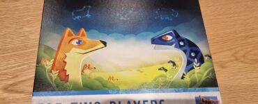 Board game box for "Great Plains," designed for two players, featuring colorful illustrations of a fox and a dinosaur in a vibrant natural landscape.