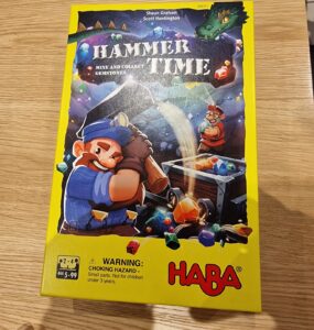 Colorful board game box for "Hammer Time," featuring vibrant illustrations of miners and gemstones, designed for 2-4 players aged 5 and up, by HABA. The box highlights the game's objective to mine and collect gemstones.