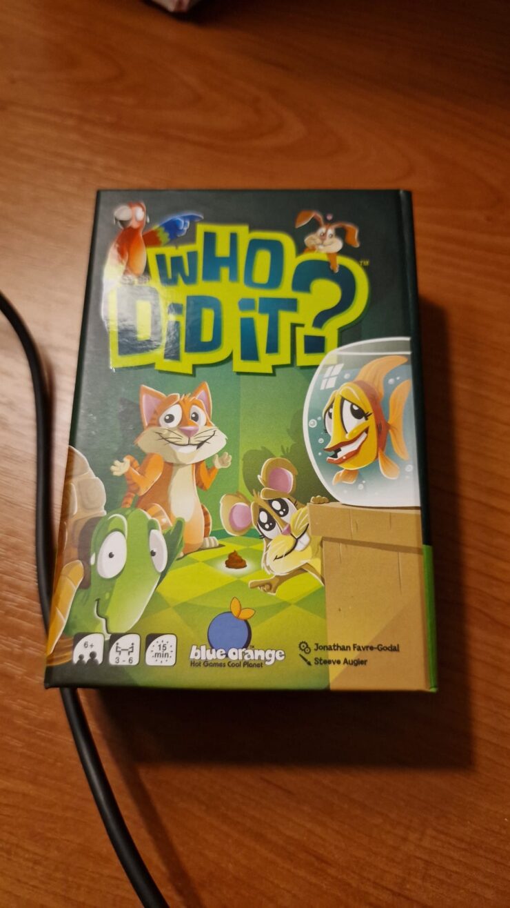 Colorful board game box for "Who Did It?" featuring cartoon animals, designed for 3-6 players aged 6 and up, published by Blue Orange Games. The game promotes deduction and observation skills in a fun, engaging way, perfect for family game nights.