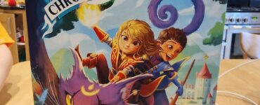 Colorful board game box titled "Kids Chronicles: Quest for the Moon Stones," featuring adventurous characters riding a magical purple cat against a whimsical background. Suitable for ages 7 and up, designed by David Cicurel, published by Lucky Duck Games.
