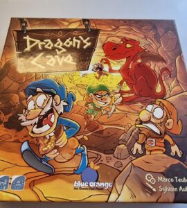 Colorful board game box for "Dragon's Cave" featuring whimsical characters, a dragon, and a treasure-filled cave setting. Designed for 2-4 players, ages 7 and up, with a playtime of approximately 25 minutes. Created by Marco Teubner, Sylvain Aublin, and Stivo, published by Blue Orange Games.