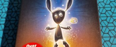 Box cover of the board game "The Mind" by Wolfgang Warsch, featuring a cartoon character with long ears and a playful expression. The design highlights the text "Over 1 million copies sold" in a red circle, promoting its popularity. The background has a glowing effect, emphasizing the game's engaging theme.