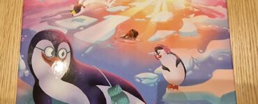 Colorful board game box for "Pengo Jump" featuring playful penguins on an ice-themed design, published by Blue Orange Games. Suitable for ages 6 and up, accommodating 1 to 4 players with a gameplay duration of approximately 10 minutes.