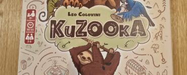 Colorful board game box for "KuZooKa" by Leo Colovini, featuring whimsical animal illustrations including a lion, monkey, sloth, and birds, designed for 2 to 4 players aged 10 and up.