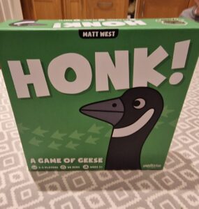 Image of the board game "Honk!" by Matt West, featuring a cartoon goose on the box cover. The game is designed for 2-5 players, takes about 20 minutes to play, and is suitable for ages 8 and up. The box is predominantly green with playful graphics.