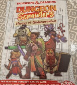 Cover of the board game "Dungeon Crawlers: Heroes of Undermountain," featuring colorful illustrations of diverse fantasy characters, including an orc, elf, and dwarf, set against a graph paper background. The title emphasizes the game's real-time dungeon racing theme, created by Vangelis Bagiartakis and Konstantinos Karagiannis, published by WizKids.