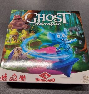 Board game box for "Ghost Adventure" featuring colorful artwork of characters in a whimsical forest setting. The game is suitable for ages 8 to 99, supports 1 to 4 players, and has an average playtime of 20 minutes. Branding includes Spinboard and Buzzing Games logos.