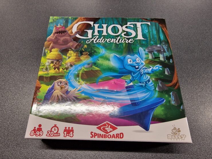 Board game box for "Ghost Adventure" featuring colorful artwork of characters in a whimsical forest setting. The game is suitable for ages 8 to 99, supports 1 to 4 players, and has an average playtime of 20 minutes. Branding includes Spinboard and Buzzing Games logos.