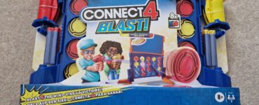 Connect 4 Blast! board game by Hasbro Gaming, featuring colorful game pieces and Nerf blaster, designed for ages 8 and up. The game encourages competitive play with a fun twist on the classic Connect 4. Ideal for family game nights and gatherings.
