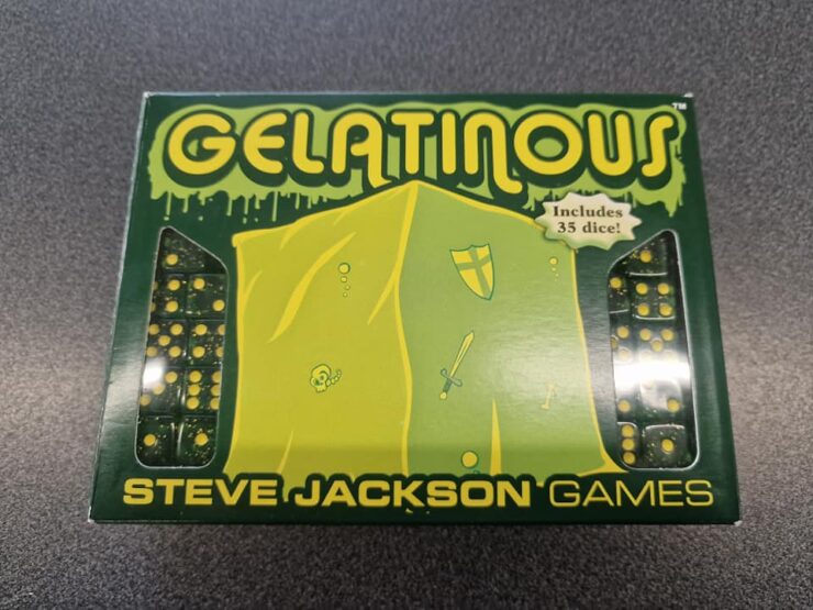 Box of the board game "Gelatinous" by Steve Jackson Games, featuring vibrant green packaging and illustrations of a gelatinous creature, swords, and shields. Includes 35 dice for gameplay.