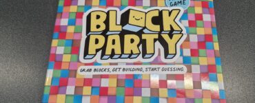 Colorful board game box titled "Block Party," designed for 2-6 players aged 8 and up, featuring the tagline "Grab blocks, get building, start guessing." The box is adorned with a vibrant, patterned background.