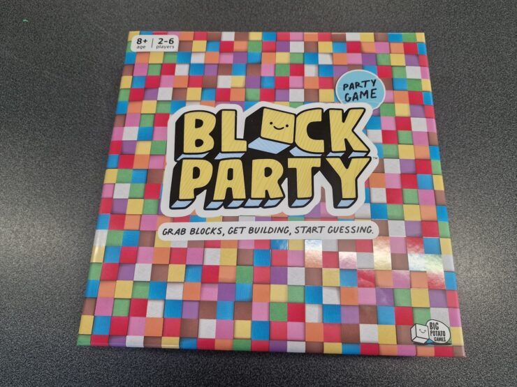 Colorful board game box titled "Block Party," designed for 2-6 players aged 8 and up, featuring the tagline "Grab blocks, get building, start guessing." The box is adorned with a vibrant, patterned background.