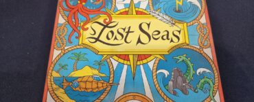 Colorful board game box for "Lost Seas" featuring an octopus, mythical sea creatures, and a nautical design. The game is suitable for 2-4 players, ages 7 and up, with a playtime of approximately 20 minutes. Published by Blue Orange Games, designed by Johan Benvenuto and Alexandre Droit, with artwork by Marine Joumard.