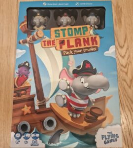 Colorful board game box for "Stomp the Plank," featuring playful pirate elephants on a ship. The design showcases vibrant graphics, game details, and player information, suitable for 2-4 players and a quick 15-minute playtime.