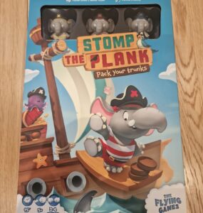 Colorful board game box for "Stomp the Plank," featuring playful pirate elephants on a ship. The design showcases vibrant graphics, game details, and player information, suitable for 2-4 players and a quick 15-minute playtime.