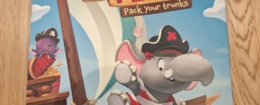 Colorful board game box for "Stomp the Plank," featuring playful pirate elephants on a ship. The design showcases vibrant graphics, game details, and player information, suitable for 2-4 players and a quick 15-minute playtime.
