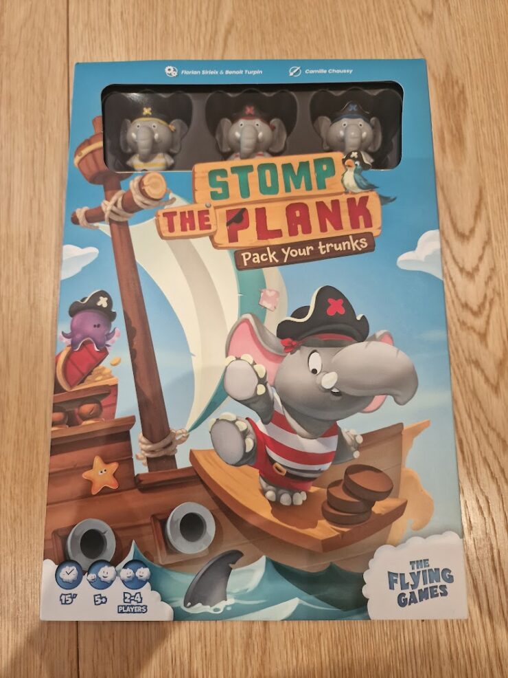 Colorful board game box for "Stomp the Plank," featuring playful pirate elephants on a ship. The design showcases vibrant graphics, game details, and player information, suitable for 2-4 players and a quick 15-minute playtime.