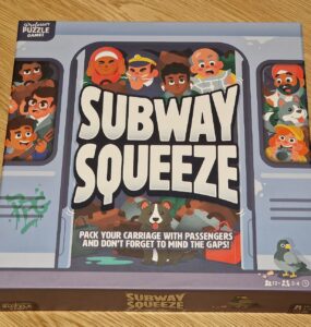 Colorful board game box for "Subway Squeeze," featuring cartoon-style illustrations of diverse passengers in a subway train. The box emphasizes gameplay elements like packing the carriage and avoiding gaps, suitable for 2-4 players aged 12 and up, with an estimated playtime of 30 minutes.