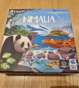 Nimala board game box featuring a panda illustration, designed by Pauline Détraz, suitable for 2-4 players aged 10 and up, with an average playtime of 30 minutes. The artwork showcases a vibrant landscape with animals and nature elements.
