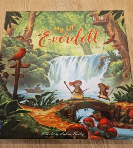 Cover of the board game "My Lil' Everdell," featuring vibrant artwork by Andrew Bosley. The illustration showcases a whimsical forest scene with characters like mice and frogs, a waterfall, and lush greenery, highlighting the enchanting world of Everdell. Perfect for family game nights and young players.