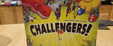 Image of the board game "Challengers!" designed by Johannes Krenner and Markus Slawitscheck, featuring colorful illustrations of various characters including a dinosaur, robots, and whimsical creatures. The game is published by Z-Man Games, showcasing an engaging and fun design suitable for family game nights.
