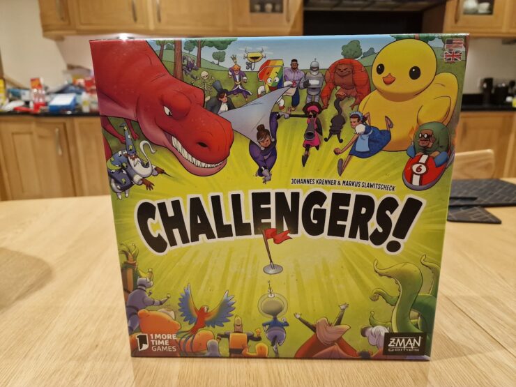 Image of the board game "Challengers!" designed by Johannes Krenner and Markus Slawitscheck, featuring colorful illustrations of various characters including a dinosaur, robots, and whimsical creatures. The game is published by Z-Man Games, showcasing an engaging and fun design suitable for family game nights.