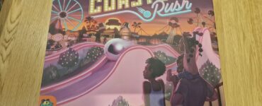 Board game box for "Roller Coaster Rush" by Scott Almes, featuring vibrant artwork of a theme park with roller coasters and attractions. The design includes playful characters enjoying the amusement park atmosphere, highlighting the game's fun and engaging theme. Published by Pandasaurus Games.