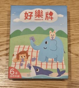 Colorful children's game box featuring cartoon animals, including an elephant, a lion, and a rabbit, with the title "Touch It" in Chinese characters. Suitable for ages 6 and up, designed for interactive play and learning.