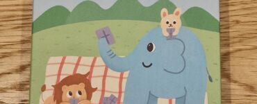 Colorful children's game box featuring cartoon animals, including an elephant, a lion, and a rabbit, with the title "Touch It" in Chinese characters. Suitable for ages 6 and up, designed for interactive play and learning.