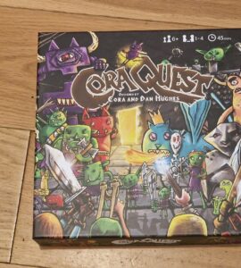 Board game box for "Cora Quest," designed by Cora and Dan Hughes, featuring colorful illustrations of various whimsical creatures and characters. Suitable for 1-4 players, ages 6 and up, with an average playtime of 45 minutes.