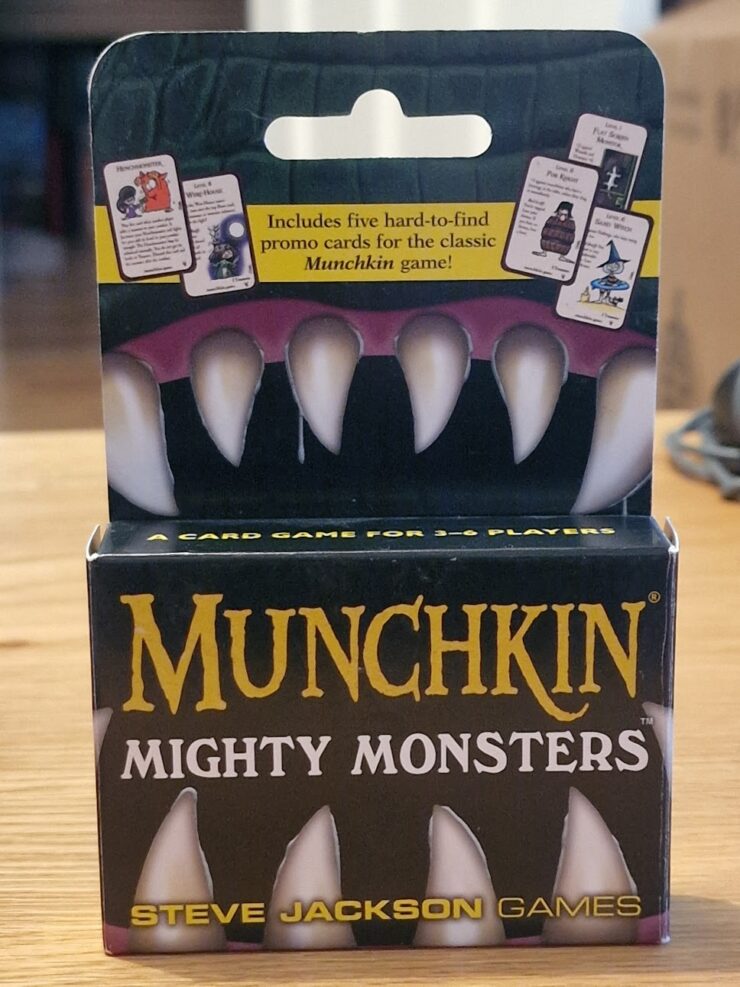 Munchkin Mighty Monsters card game packaging featuring five exclusive promo cards, designed for 3-6 players, by Steve Jackson Games.