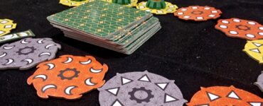 Image of the board game "Quicksand" displayed at EGX, featuring colorful game pieces including hexagonal tokens and hourglasses, highlighting the cooperative gameplay and real-time challenge elements.