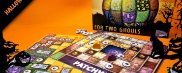 Patchwork Halloween Edition board game displayed on an orange background, featuring a colorful pumpkin design and game pieces. The box indicates it's designed for two players, emphasizing a spooky theme suitable for Halloween.