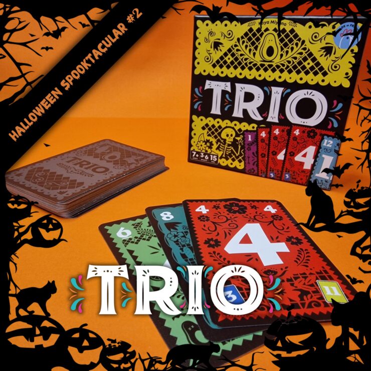 Colorful card game "Trio" displayed on an orange background, featuring a stack of cards and the game box. The cards showcase vibrant designs with numbers, perfect for family game nights. Ideal for ages 7 and up, emphasizing fun and strategy. Halloween-themed decorations enhance the festive atmosphere.