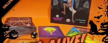 Board game "It's Alive! Monster-Making Mayhem" displayed with game cards and dice on an orange background, suitable for 2-6 players aged 8 and up, designed by Gremlin Games for Halloween fun.