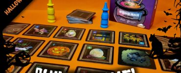 Colorful board game setup featuring "Glastonbury" with a Halloween theme, showcasing cards and game pieces on an orange background. The image includes the game box, several cards depicting spooky illustrations, and blue and yellow player tokens. Perfect for Halloween game nights.