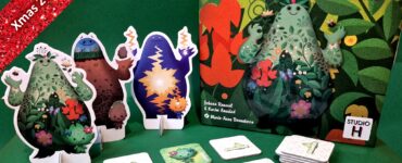 Colorful Gigamon board game setup featuring vibrant character standees and cards, with a festive background for the Xmas 2023 Holiday Marathon.