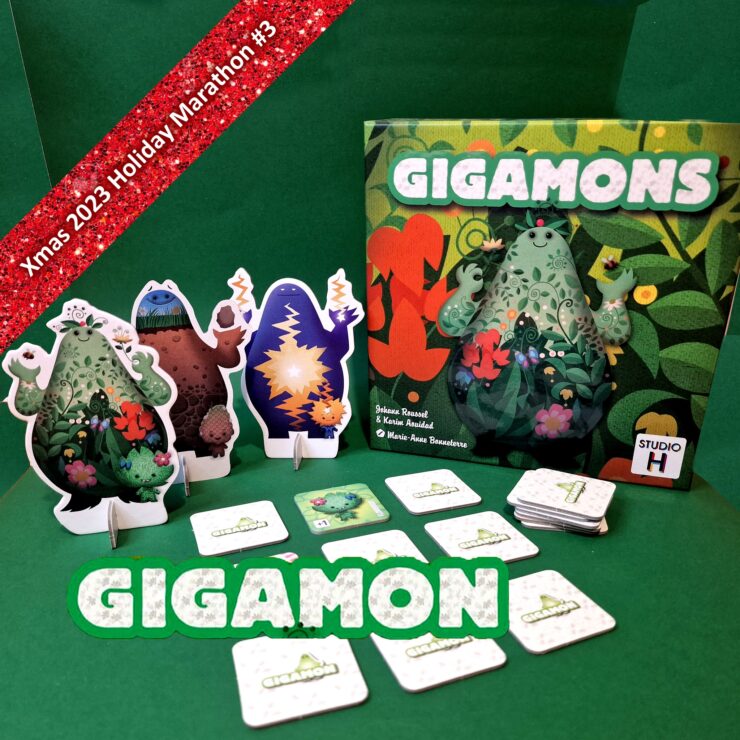 Colorful Gigamon board game setup featuring vibrant character standees and cards, with a festive background for the Xmas 2023 Holiday Marathon.