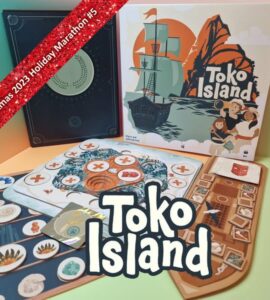 Colorful board game setup featuring "Toko Island" box art, game cards, and player boards. The image highlights components of the game and a festive banner indicating "Xmas 2023 Holiday Marathon #5." Ideal for board game enthusiasts and collectors.