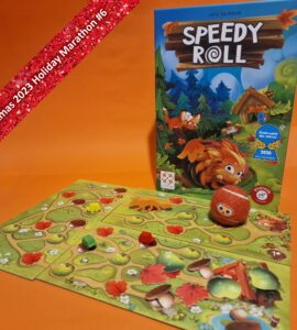 Colorful board game "Speedy Roll" displayed with game pieces and boards on an orange background, featuring playful forest animals and vibrant graphics. Ideal for family game nights, suitable for children aged 7 and up. Part of the Xmas 2023 Holiday Marathon.