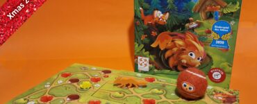 Colorful board game "Speedy Roll" displayed with game pieces and boards on an orange background, featuring playful forest animals and vibrant graphics. Ideal for family game nights, suitable for children aged 7 and up. Part of the Xmas 2023 Holiday Marathon.
