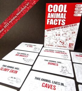 Colorful game "Cool Animal Facts" displayed with cards showcasing interesting animal traits. The game box highlights features like "Know Your Stuff or When to Bluff," suitable for ages 8 and up. Cards reveal fun facts about various animals, including habitats and characteristics. Perfect for family game nights and educational fun.