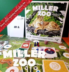 Miller Zoo cooperative board game displayed on a colorful game board, featuring a lion illustration on the box cover. The image includes game components like player tokens and character cards, along with a festive banner indicating "Xmas 2023 Holiday Marathon #4."