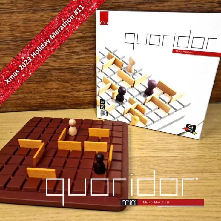 Mini Quoridor board game by Mirko Marchesi displayed on a wooden surface, featuring a brown game board with wooden barriers and player pieces. The game box is in the background, highlighting its design. Text overlay indicates "Xmas 2023 Holiday Marathon #11."