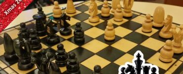 Chess game in progress on a wooden chessboard with black and wooden pieces, featuring a festive background and a logo for a holiday marathon event.