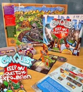 Cora Quest: Keep On Questing expansion game displayed on a wooden table, featuring game board, character tokens, and various game components, highlighting colorful artwork and gameplay elements suitable for family fun.
