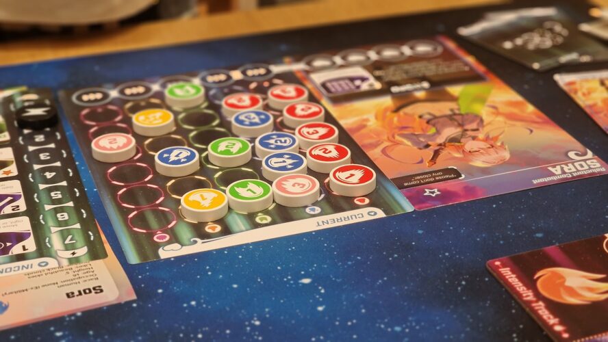 Close-up of a board game setup featuring colorful tokens, a current track, and character cards on a starry background, highlighting gameplay elements and strategy in a sci-fi theme.