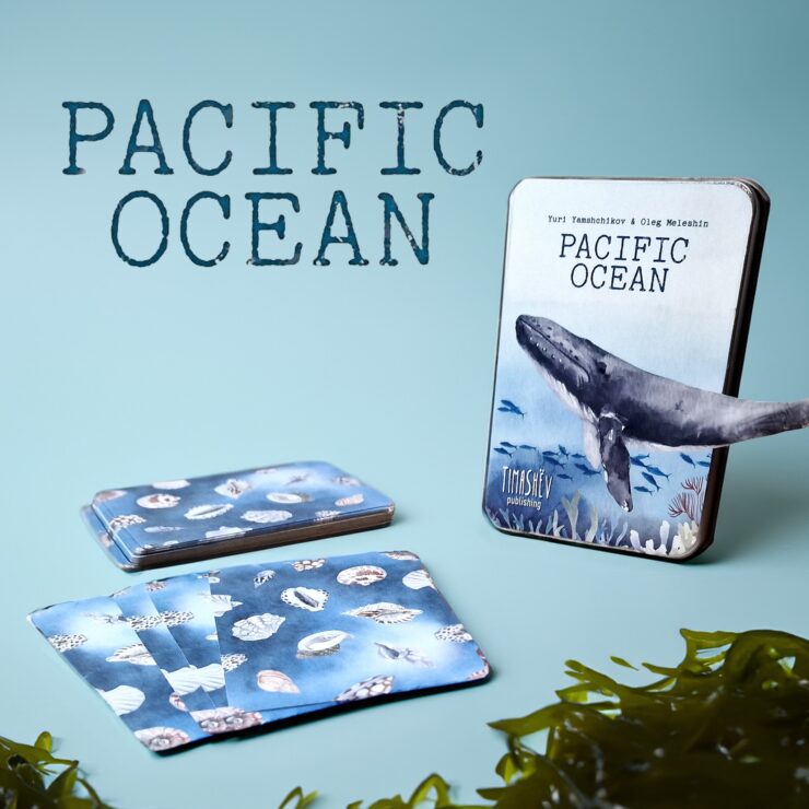 Pacific Ocean-themed card game featuring beautifully illustrated cards showcasing marine life, including shells and a whale, alongside the game box. Ideal for ocean enthusiasts and educational purposes.